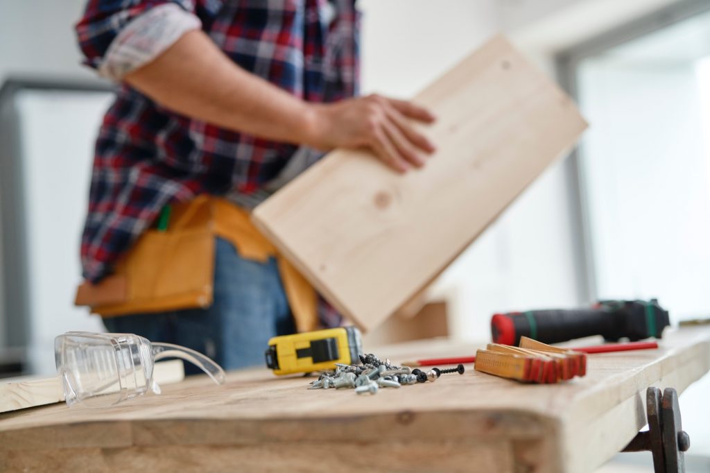 man with table full of power tools