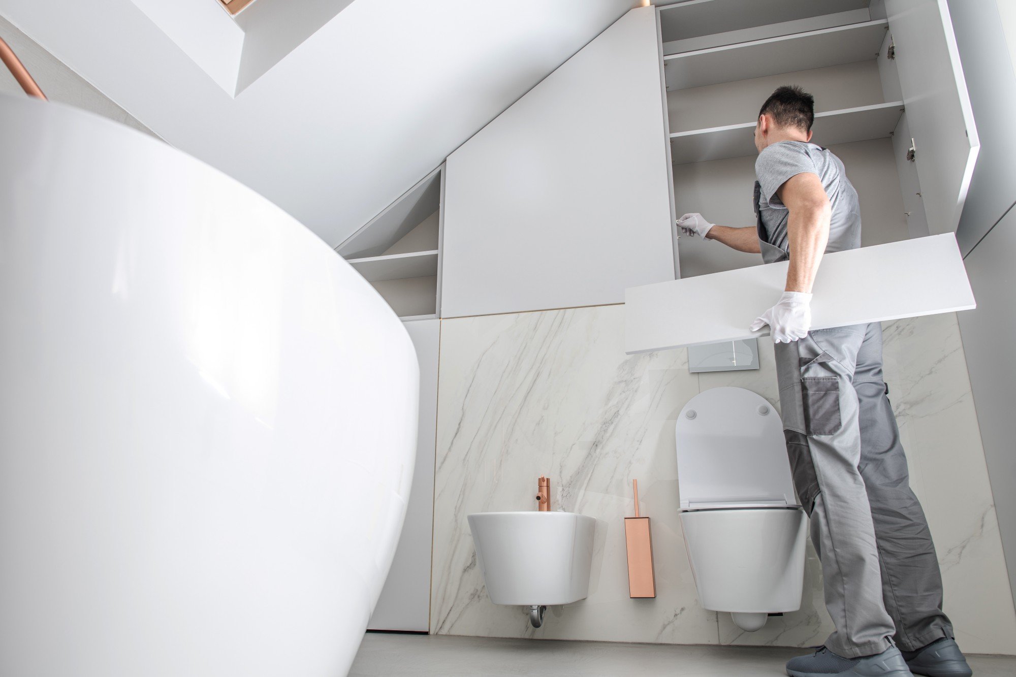 Contractor fixing bathroom cabinets