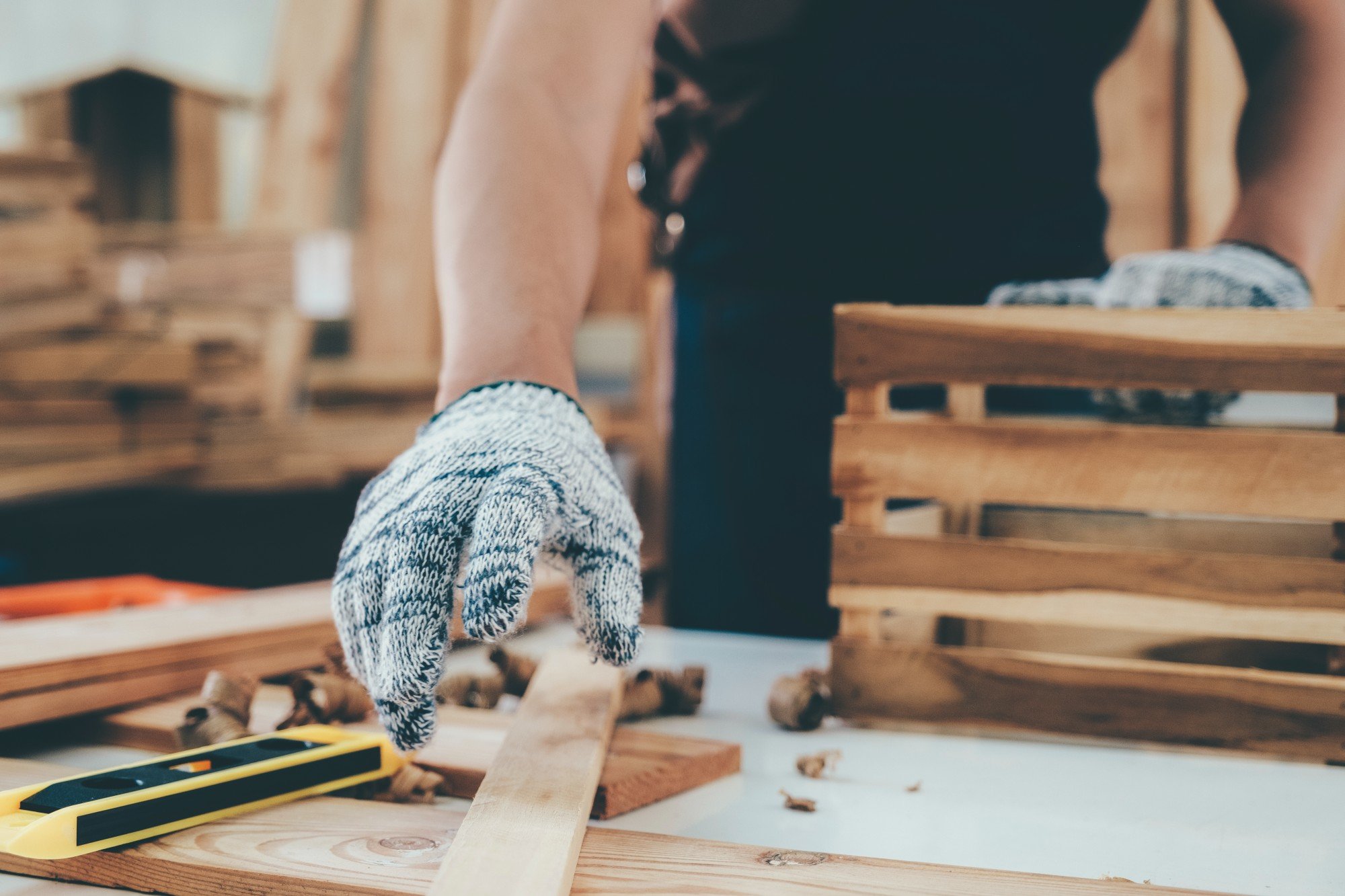 man working with wood in his workshop